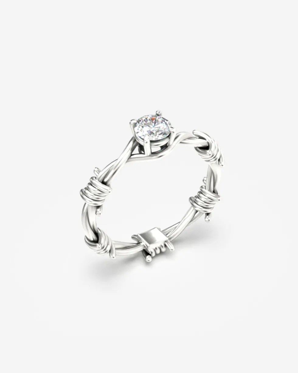 ANELLO SOLITARIO FILO SPINATO ORO CON DIAMANTE