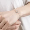 BRACCIALE IN ARGENTO RODIATO CON CERCHIO CON BRILLANTI